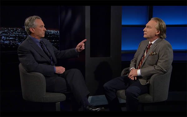 Bill Maher (right) pays rapt attention to Robert F. Kennedy, Jr. (left) as he gives pointers about how to be a crankier antivaccine crank.