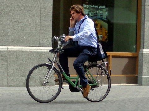 Which poses a greater risk - the cell phone or the lack of a helmet?