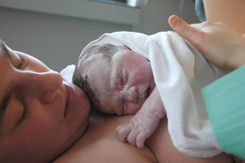 A brand-new newborn. According to BFHI rules, he must maintain continuous skin contact with Mom and start breastfeeding with in the first half hour.