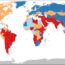 World map with countries colored in red, orange, blue, and light blue. Each color represents different data categories. The map includes all continents except Antarctica.