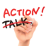 A hand holding a red marker crosses out the word "TALK" and writes "ACTION!" in red, capital letters. The message emphasizes action over talk, symbolizing taking initiative and making changes. The background is white.