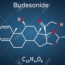 Chemical structure diagram of Budesonide, displaying its molecular formula C25H34O6. The structure includes hexagonal and pentagonal carbon rings and oxygen atoms, with hydrogens implicitly shown. The background is a dark blue gradient.