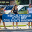 Four women stand on a sidewalk holding a large blue banner that reads "MEDICAL FREEDOM IS THE NEW CIVIL RIGHTS MOVEMENT." Two of them wear shirts saying "WE ARE THE RESISTANCE." Cars are parked in the background.