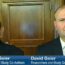 Two men in suits, identified as Dr. Mark Geier and David Geier, appear on a Fox 19 news broadcast. Both are seated indoors in front of a wooden cabinet and bookshelves, with name labels shown at the bottom.