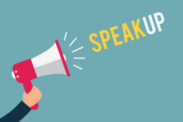 Illustration of a hand holding a red and white megaphone, with the words “SPEAK UP” coming out in bold yellow and white letters on a blue background.