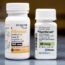 Two prescription pill bottles labeled Eltroxin (100 mcg) and Synthroid (88 mcg), both containing levothyroxine tablets, are placed side by side on a gray surface.