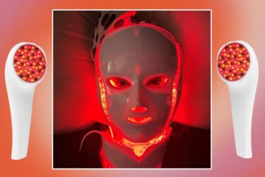 A person wears a white LED face mask emitting red light, lying on a pillow. The background is a red gradient with two white handheld LED light devices shown on each side.