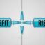 Two syringes filled with blue liquid face each other, labeled "BENEFIT" on the left and "RISK" on the right, with their needles nearly touching in the center.