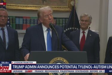 Former President Donald Trump speaks at a podium with officials standing behind him during a televised press conference. News ticker mentions a potential Tylenol-autism link and displays the time as 2:49 PM.