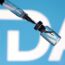 A syringe drawing liquid from a vial is shown in front of a blurred FDA logo on a blue background.