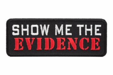 A rectangular black patch with white text reading "SHOW ME THE" and bold red text below reading "EVIDENCE.