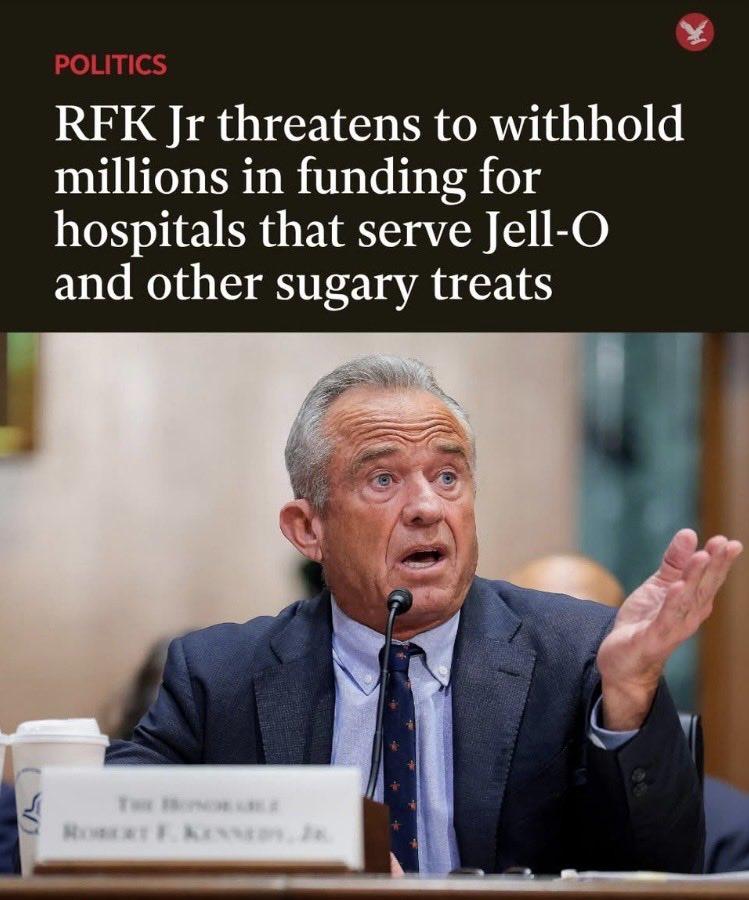 A man in a suit, identified as Robert F. Kennedy Jr., speaks into a microphone at a hearing. A headline above him states he threatens to withhold funding from hospitals that serve Jell-O and other sugary treats.