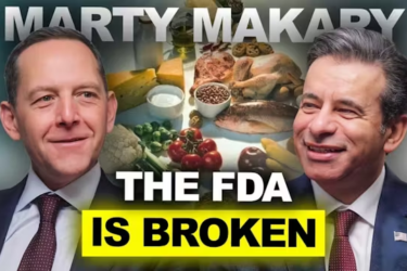 Two men in suits are smiling on either side of a table filled with various foods. Bold text says "THE FDA IS BROKEN" with "MARTY MAKARY" at the top. The words "ALL IN" appear in the bottom left corner.