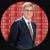 A man in a suit smiles, his portrait superimposed on a red background with "NO MORE LOCKDOWNS!" repeated.