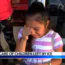 Young girl wipes her eyes while sitting outside a building. Text reads, “Taking care of children left by ICE.” Other children and an adult are partially visible nearby.