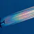 A commercial airplane in flight, leaving a bright, iridescent rainbow-colored contrail against a deep blue sky.